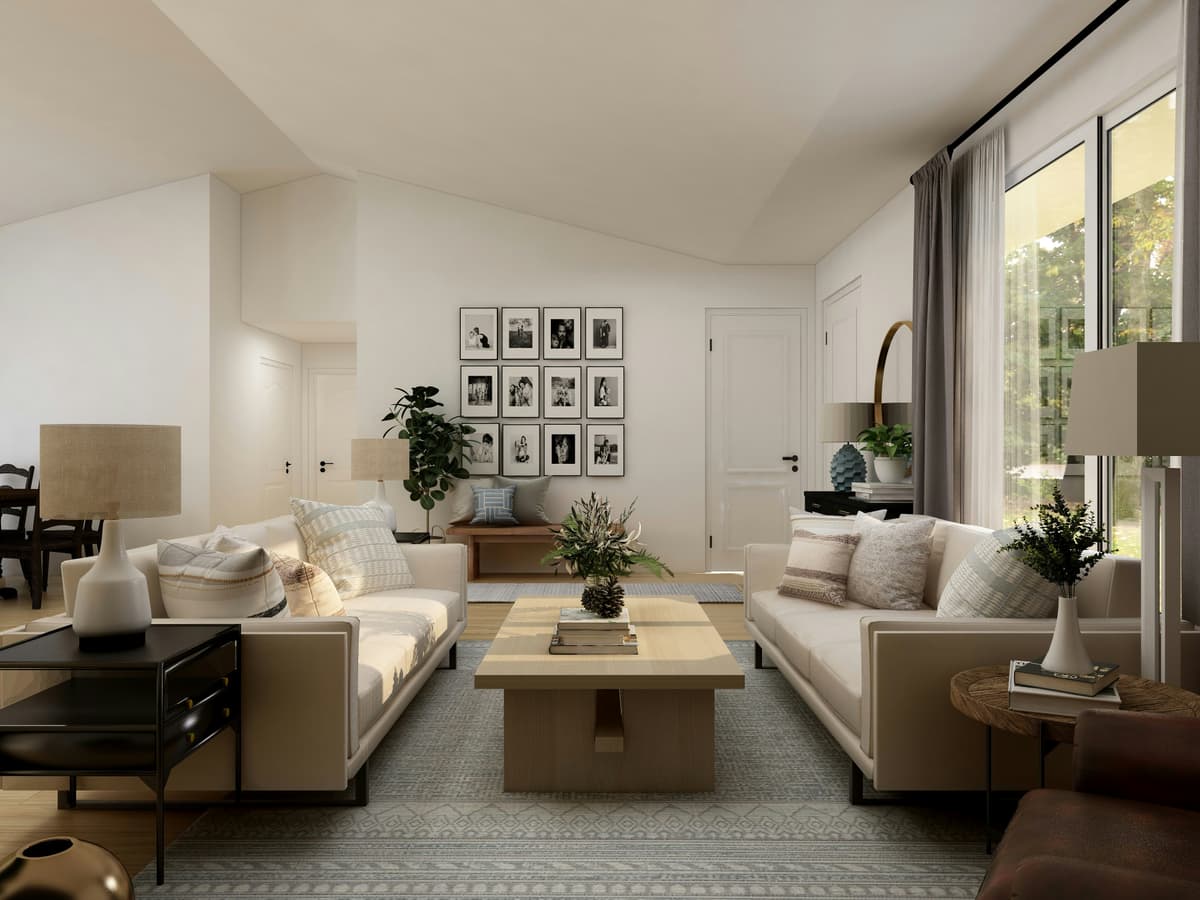 Through-lounge decorated in warm neutrals with a gallery wall of framed pictures